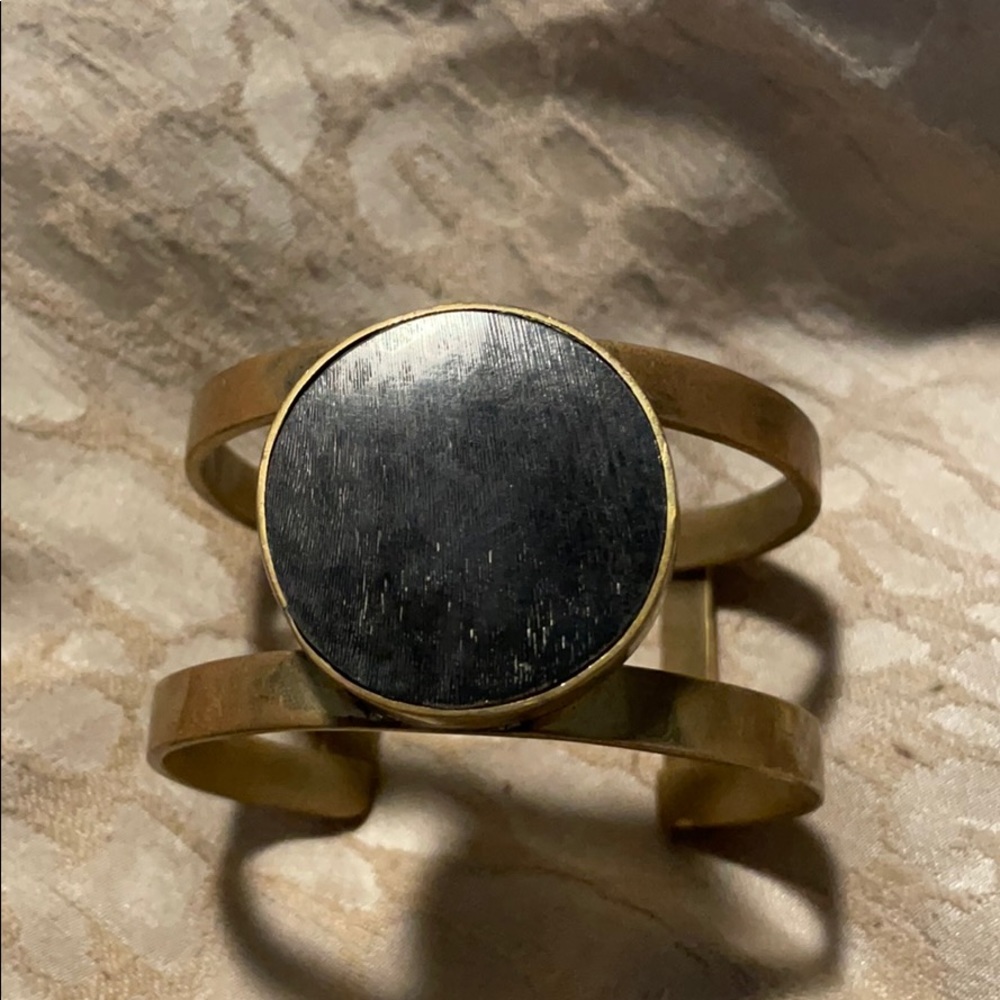 Gold cuff with black stone